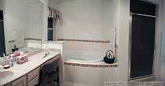 Master Bath, includes a large soaking tub and a marble panaled shower.